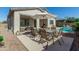 Spacious patio with dining set and adjacent to the pool at 9447 W Patrick Ln, Peoria, AZ 85383