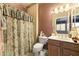 Bathroom with shower/tub combo and wood vanity at 15101 W Waterford Dr, Surprise, AZ 85374