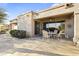 Covered patio with flagstone flooring and seating area at 15101 W Waterford Dr, Surprise, AZ 85374