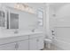 Stylish bathroom with dual vanity, large mirror, and tub/shower combo at 18532 E Dario Rd, Gold Canyon, AZ 85118