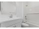 White bathroom with white tiled shower and bath, and vanity with mirror at 18532 E Dario Rd, Gold Canyon, AZ 85118
