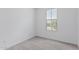 Bright carpeted bedroom features a large window and neutral color scheme at 18532 E Dario Rd, Gold Canyon, AZ 85118