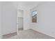 Bright carpeted bedroom with closet and large window with view to outside at 18532 E Dario Rd, Gold Canyon, AZ 85118