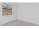 Neutral carpet and light colored walls in bedroom with large window at 18532 E Dario Rd, Gold Canyon, AZ 85118