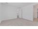 Spacious carpeted bedroom with neutral walls and doorway to other rooms at 18532 E Dario Rd, Gold Canyon, AZ 85118