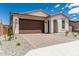 Inviting single-story home with a brick driveway and easy-care landscaping at 18532 E Dario Rd, Gold Canyon, AZ 85118