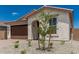 Stylish single-story home with a tile roof, easy-care landscaping, and a welcoming entrance at 18532 E Dario Rd, Gold Canyon, AZ 85118