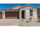 Beautiful single-story home with a brick driveway and decorative landscaping in front at 18532 E Dario Rd, Gold Canyon, AZ 85118