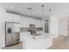 Modern kitchen featuring stainless steel appliances, white cabinets and a large island at 18532 E Dario Rd, Gold Canyon, AZ 85118