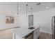 Spacious kitchen island with stainless steel sink and modern pendant lighting at 18532 E Dario Rd, Gold Canyon, AZ 85118