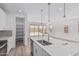 Open concept kitchen with a large island, stainless appliances, and pantry at 18532 E Dario Rd, Gold Canyon, AZ 85118