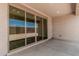 Covered patio area with tile flooring and floor to ceiling sliding glass doors at 18532 E Dario Rd, Gold Canyon, AZ 85118