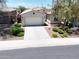 Inviting single-Gathering home boasting a well-manicured front yard with desert landscaping and an attached two-car garage at 10637 W Eucalyptus Rd, Peoria, AZ 85383