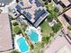 Aerial shot of backyard oasis with pool, spa, lush greenery, and solar panels on roof at 10637 W Eucalyptus Rd, Peoria, AZ 85383