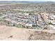 Wide aerial view of a residential area showcasing homes with pools and well-maintained streets at 10637 W Eucalyptus Rd, Peoria, AZ 85383