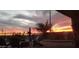 Sunset view from backyard patio with fire pit and built-in BBQ at 10637 W Eucalyptus Rd, Peoria, AZ 85383