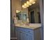 Bathroom vanity features a white countertop, sink, and stylish chrome faucet at 10637 W Eucalyptus Rd, Peoria, AZ 85383