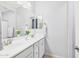 Bright bathroom featuring double sinks, white cabinets, and a large mirror for a spacious feel at 10637 W Eucalyptus Rd, Peoria, AZ 85383