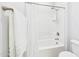 Clean and bright bathroom featuring a shower-tub combination with white tiled walls at 10637 W Eucalyptus Rd, Peoria, AZ 85383