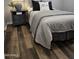 Inviting bedroom featuring a comfortable bed with neutral-toned bedding and a bedside table, creating a restful sanctuary at 10637 W Eucalyptus Rd, Peoria, AZ 85383