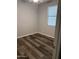 Bedroom featuring wood flooring and neutral paint at 10637 W Eucalyptus Rd, Peoria, AZ 85383