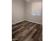 Bedroom featuring wood flooring and neutral paint at 10637 W Eucalyptus Rd, Peoria, AZ 85383