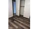 Bedroom with wood flooring and walk-in closet at 10637 W Eucalyptus Rd, Peoria, AZ 85383