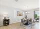 Elegant dining room with a decorative chandelier and an outdoor view at 10637 W Eucalyptus Rd, Peoria, AZ 85383