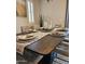 Elegant dining room showcasing a large table, stylish place settings, and neutral decor, ideal for gatherings and meals at 10637 W Eucalyptus Rd, Peoria, AZ 85383