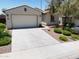 Charming single-story home with a two-car garage, desert landscaping, and a well-maintained lawn at 10637 W Eucalyptus Rd, Peoria, AZ 85383