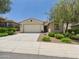 Charming single-story home featuring a neutral color palette, desert landscaping, and an attached two-car garage at 10637 W Eucalyptus Rd, Peoria, AZ 85383