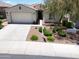 Lovely one-story home with a well-maintained lawn, desert landscaping, and convenient two-car garage at 10637 W Eucalyptus Rd, Peoria, AZ 85383