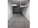 View of the garage, featuring overhead shelving and ample space at 10637 W Eucalyptus Rd, Peoria, AZ 85383