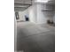 Shot of the garage interior, with water heater, water treatment system and storage space at 10637 W Eucalyptus Rd, Peoria, AZ 85383