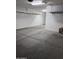 The garage shows the door into the house and the open concrete floor at 10637 W Eucalyptus Rd, Peoria, AZ 85383