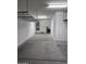Garage view showcases water heater, water treatment system, and door to inside at 10637 W Eucalyptus Rd, Peoria, AZ 85383