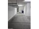 The garage shows the water heater, water treatment system and overhead shelving at 10637 W Eucalyptus Rd, Peoria, AZ 85383