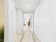 Bright hallway with decorative tile and an open view to a living area at 10637 W Eucalyptus Rd, Peoria, AZ 85383