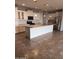 Bright kitchen features a large center island, stainless steel appliances, and white cabinets at 10637 W Eucalyptus Rd, Peoria, AZ 85383