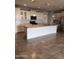 Bright kitchen features a large center island, stainless steel appliances, and white cabinets at 10637 W Eucalyptus Rd, Peoria, AZ 85383