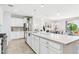 Open concept kitchen with large center island and stainless steel appliances at 10637 W Eucalyptus Rd, Peoria, AZ 85383