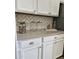 Close up on the white kitchen cabinets and countertops, with decorative tile backsplash at 10637 W Eucalyptus Rd, Peoria, AZ 85383