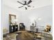 Well-appointed home office featuring a glass desk, comfortable seating, and stylish accessories, creating a productive environment at 10637 W Eucalyptus Rd, Peoria, AZ 85383