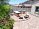 Backyard patio with built-in grill, seating, and desert landscaping creating a private oasis at 10637 W Eucalyptus Rd, Peoria, AZ 85383