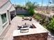 Overhead view of outdoor patio featuring a fire pit, seating, and a built-in kitchen area at 10637 W Eucalyptus Rd, Peoria, AZ 85383