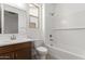 Bathroom with bathtub, toilet and vanity, all in white and neutral colors at 18525 E Dario Rd, Gold Canyon, AZ 85118