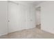 Bedroom with neutral carpet, showing a door and closet, both in white at 18525 E Dario Rd, Gold Canyon, AZ 85118