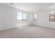 Bright and airy bedroom features plush carpeting and large windows at 18525 E Dario Rd, Gold Canyon, AZ 85118