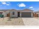 Beautiful single-story home featuring a paver driveway, low maintenance yard, and neutral color palette at 18525 E Dario Rd, Gold Canyon, AZ 85118