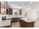 Gourmet kitchen boasts sleek countertops, ample cabinet space, and a view into the spacious breakfast nook at 18525 E Dario Rd, Gold Canyon, AZ 85118